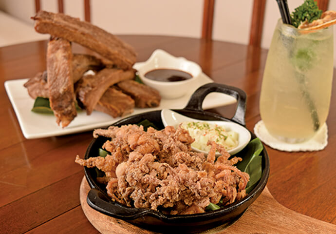 Pair your drinks with crispy pork ribs and calamari.